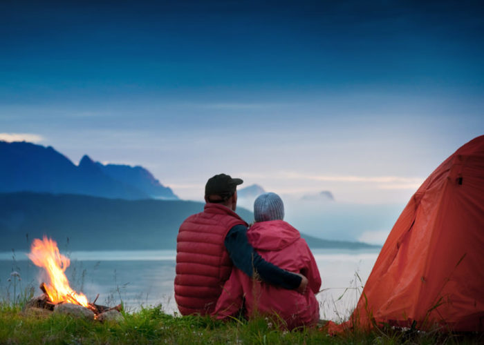 couple with tent near seaside